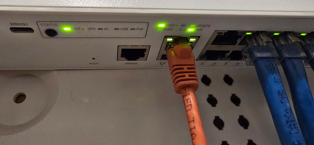 The light is blinking next to orange cable